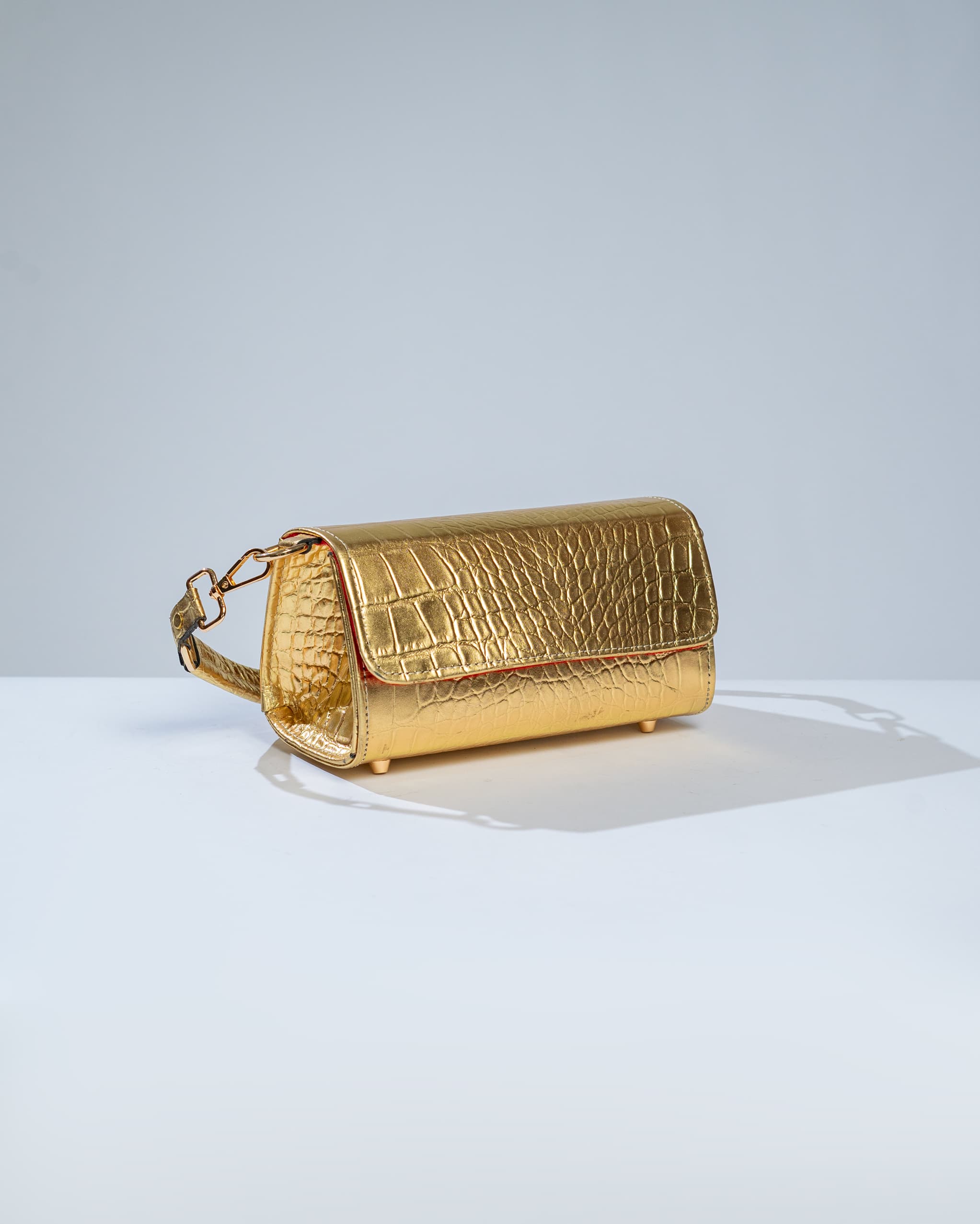 Gold mini shoulder bag.